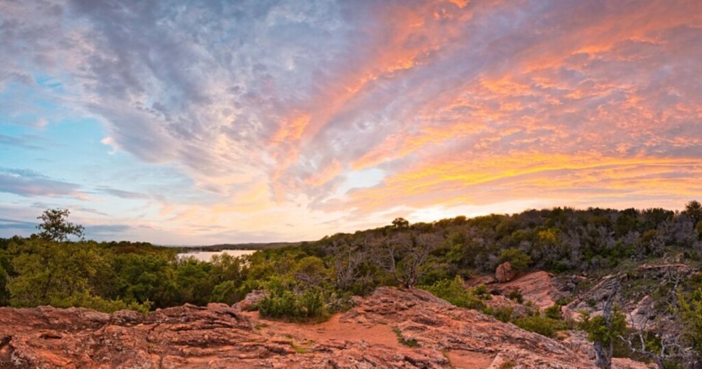 the sunset over the cliffs of edwards country in texas