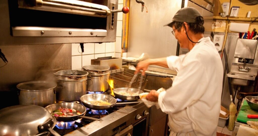 Preparing seafood in a restaurant on Hanover Street in North End, Boston